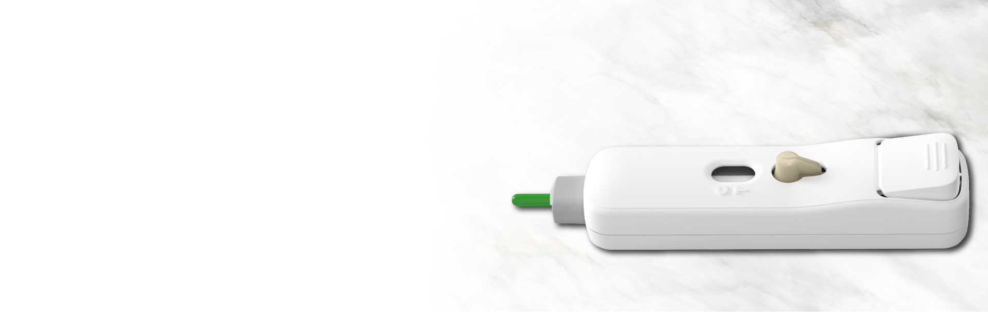 White and green diagnostic device on marble surface